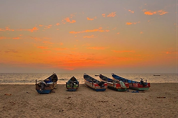  Book a cab to Alappuzha Beach and enjoy a peaceful sunset by the shore with a hassle-free ride.