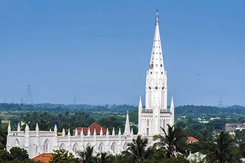 Explore Lady of Snows Church with Car or Tempo Hire, Tirunelveli Take a peaceful ride to Lady of Snows Church using our reliable van or cab booking service.